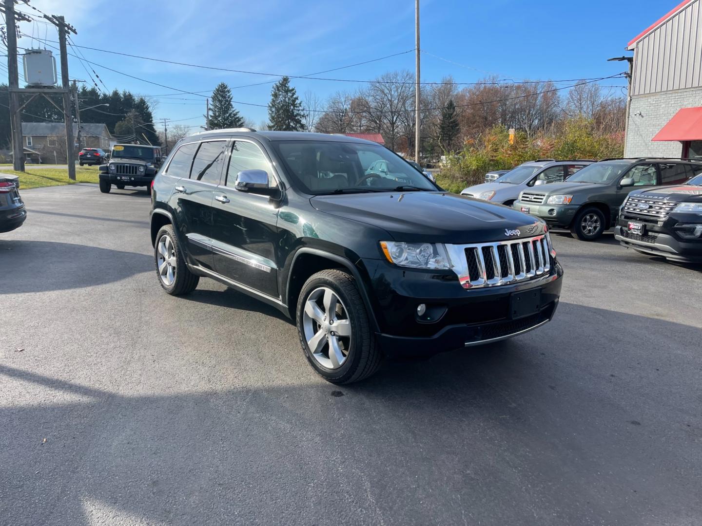 2013 Black /Gray Jeep Grand Cherokee (1C4RJFCG5DC) , located at 547 E. Main St., Orwell, OH, 44076, (440) 437-5893, 41.535435, -80.847855 - Photo#2